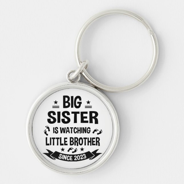 The little sister takes care of the big brother in keychain (Front)