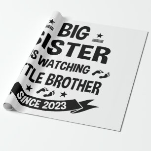 The little sister takes care of the big brother in wrapping paper