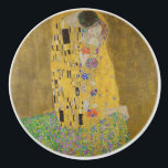 The Lovers Kissing Embrace by Gustav Klimt Ceramic Knob<br><div class="desc">Sunlight glints off the swirling golden embrace that surrounds the lovers in Gustav Klimt's masterpiece, The Kiss. The scene is a paradox of intimacy and isolation. The couple stands on a precipice, a field of colorful flowers at their feet, yet they are oblivious to the world around them. Their gazes...</div>