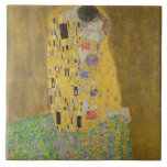 The Lovers Kissing Embrace by Gustav Klimt Ceramic Tile<br><div class="desc">Sunlight glints off the swirling golden embrace that surrounds the lovers in Gustav Klimt's masterpiece, The Kiss. The scene is a paradox of intimacy and isolation. The couple stands on a precipice, a field of colorful flowers at their feet, yet they are oblivious to the world around them. Their gazes...</div>