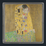 The Lovers Kissing Embrace by Gustav Klimt Gunmetal Finish Lapel Pin<br><div class="desc">Sunlight glints off the swirling golden embrace that surrounds the lovers in Gustav Klimt's masterpiece, The Kiss. The scene is a paradox of intimacy and isolation. The couple stands on a precipice, a field of colorful flowers at their feet, yet they are oblivious to the world around them. Their gazes...</div>