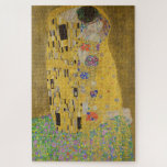 The Lovers Kissing Embrace by Gustav Klimt Jigsaw Puzzle<br><div class="desc">Sunlight glints off the swirling golden embrace that surrounds the lovers in Gustav Klimt's masterpiece, The Kiss. The scene is a paradox of intimacy and isolation. The couple stands on a precipice, a field of colorful flowers at their feet, yet they are oblivious to the world around them. Their gazes...</div>