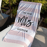 The New Mrs. | Personalized Bride Beach Towel<br><div class="desc">Our sweet personalized bride beach towel makes a perfect honeymoon gift for a newly married friend! Design features "The New Mrs. [lastname]" in modern, trendy black typography on a blush pink and white striped background. Easily customize with the bride's new last name using the field provided. Prefer this for a...</div>
