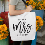 The New Mrs Personalized Bride Tote Bag<br><div class="desc">Show off your new last name with our super cute personalized bride tote! Modern black and white design features "the new  mrs. [lastname]" in handwritten script typography. Easily customize using the template field provided. Makes a great gift for a newlywed or recent bride.</div>