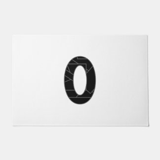 The number zero (0) in black doormat