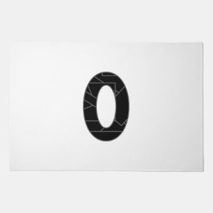 The number zero (0) in black doormat