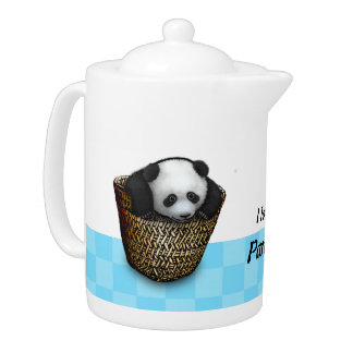 The panda cub plays with a basket teapot