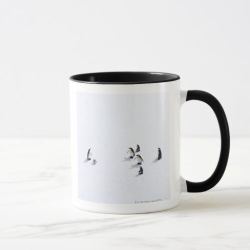 The penguins playing soccer mug