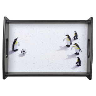 The penguins playing soccer serving tray