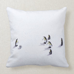 The penguins playing soccer throw pillow