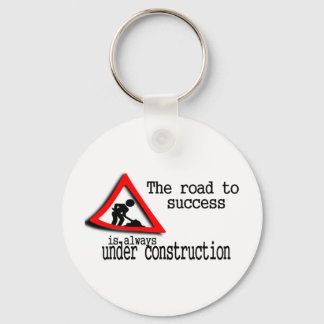 The road to success is always under construction keychain