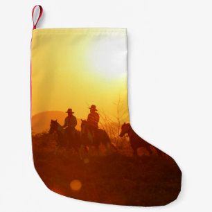 The silhouette of rider as cowboy outfit costume w small christmas stocking