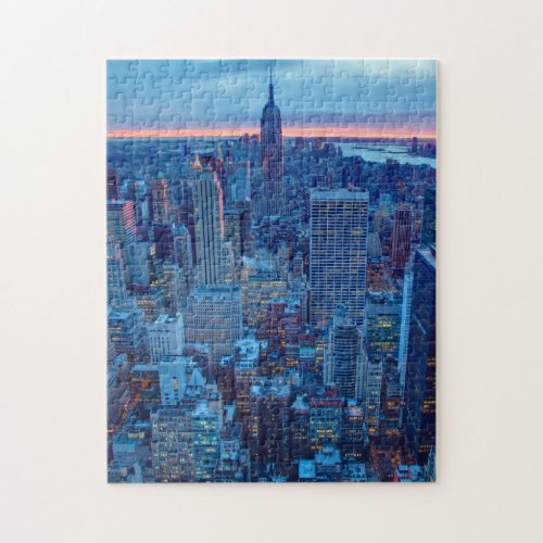 The skyscrapers of Manhattan are lit Jigsaw Puzzle