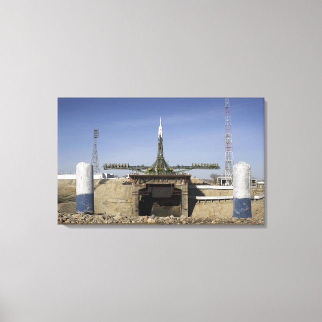 The Soyuz rocket is erected into position Canvas Print (Front)