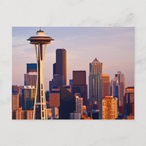 The Space Needle is a tower at dusk in Seattle Postcard