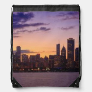 The sun sets over the Chicago skyline Drawstring Bag