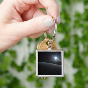 The Sun Setting Over Earth's Horizon. Keychain