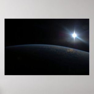 The Sun Setting Over Earth's Horizon. Poster