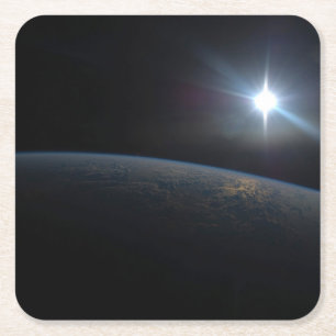 The Sun Setting Over Earth's Horizon. Square Paper Coaster
