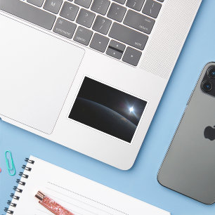 The Sun Setting Over Earth's Horizon. Sticker