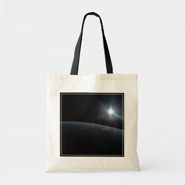 The Sun Setting Over Earth's Horizon. Tote Bag (Front)