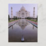 the Taj Mahal perfectly reflected in the pool in Postcard