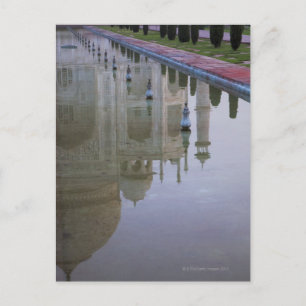 the Taj Mahal perfectly reflected in the still Postcard