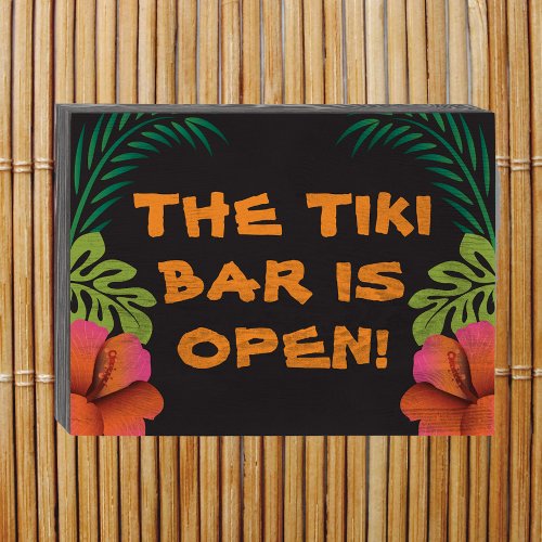 The Tiki Bar is Open sign on black