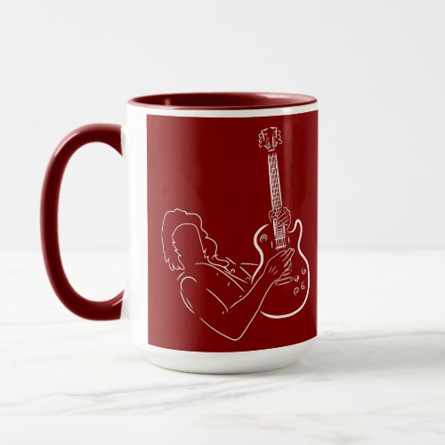 The white silhouette of a guitar and guitarist  mug