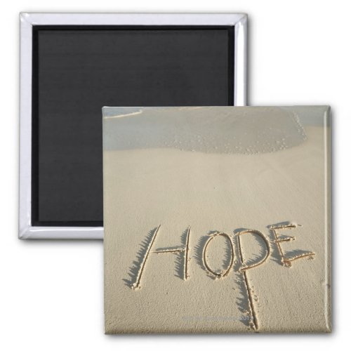 The word Hope sand written on the beach with Magnet