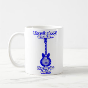 There is always time for playing the guitar. blue coffee mug