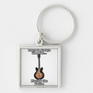 There is always time for playing the guitar. retro keychain