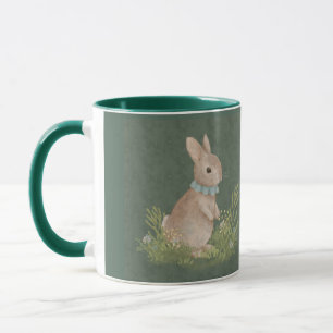 There's a rabbit with a decoration on its neck sit mug