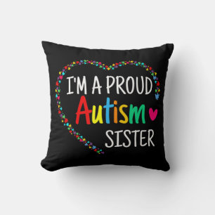 This colorful autism heart made with puzzle pieces throw pillow