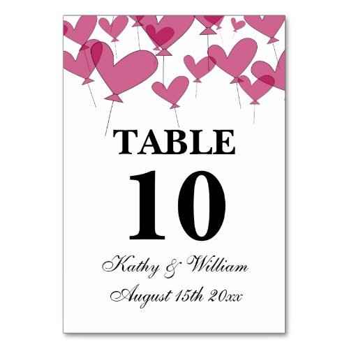 Thousand and one red heart balloons pretty wedding table number