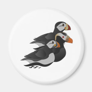 Three Adorably Friendly Puffins Swimming Cartoon Magnet