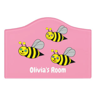 Three Bees on a pink Door sign