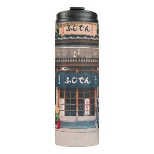 THREE BICYCLES PARKED IN FRONT OF BUILDING THERMAL TUMBLER