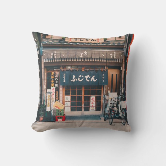 THREE BICYCLES PARKED IN FRONT OF BUILDING THROW PILLOW (Front)