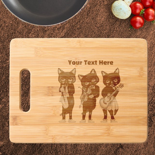 Three black Cat Musicians Playing Instruments Engraved Cutting Board (Three black cat musicians playing musical instruments on bamboo wood cutting board.)