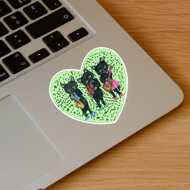 Three Black Cats Playing Music Green Heart Sticker (Black Cat musicians playing instruments in clothes on green heart with music notes on vinyl sticker.)