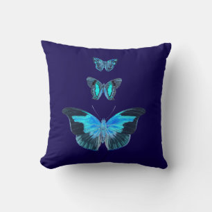Three Blue Butterflies on Dark Blue Pillow