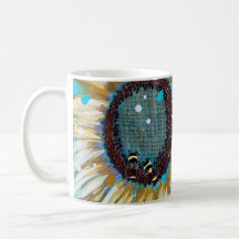 Three bumblebees on a sunflower