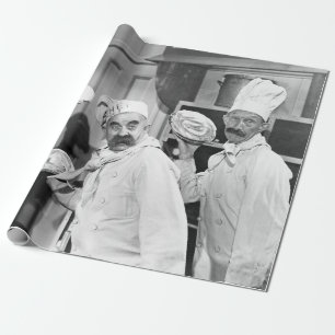 Three chefs holding pies for a fight in the kitche wrapping paper