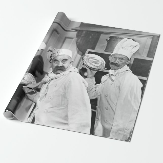 Three chefs holding pies for a fight in the kitche wrapping paper (Unrolled)