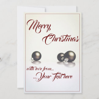 Three christmas balls in front of light background
