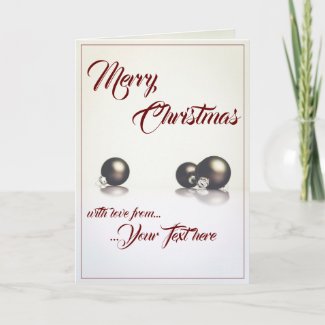 Three christmas balls in front of light background card