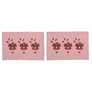 Three Christmas Candy Canes On Light Pink Pillow Case