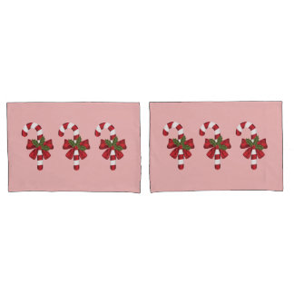 Three Christmas Candy Canes On Light Pink Pillow Case