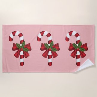 Three Christmas Candy Canes On Pink Beach Towel